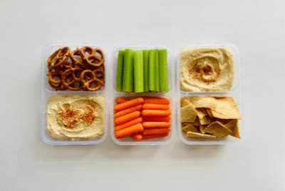 6 bowls of snacks aligned from a overhead 